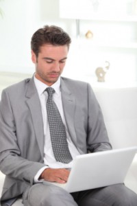 business professional using laptop: SEOLegal Law Firm Website Design Blog