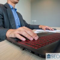 Lawyer working on law firm SEO on laptop